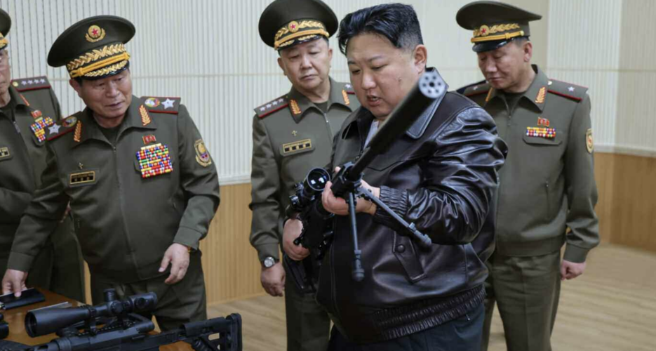 Rifle in hand, Kim Jong Un calls for more powerful North Korean weapons